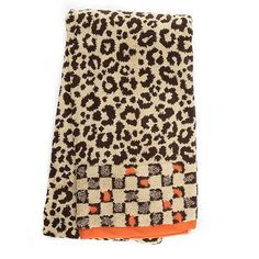 an animal print towel on a white background