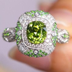 •Condition: Brand new•Center Stone: Natura Tsavorite Green Garnet, Cushion Shape, approx 1.15ct •Side Stone: Natural white diamond, round cut (VS1 clarity and F color)Natural Tsavorite round cut•Ring Weight: 5.62g (depend on the ring size)•Metal Purity: Optional Each piece is made-to-order with care and special attention to detail. all items are made with conflict-free diamonds and gems.Size: made to orderThe item will be gift wrapped and shipped.------------------------------------------------- Dazzling Green Diamond Ring, Luxury Green Sapphire Ring Gia Certified, Green Sapphire Ring With Halo Setting For Promise, Luxury Peridot Rings With Accent Stones, Green Gia Certified Sapphire Ring, Green Gia Certified Luxury Sapphire Ring, Luxury Green Diamond Ring With Brilliant Cut, Dazzling Green Diamond Ring With Brilliant Cut, Luxury Green Diamond Ring With Halo Setting