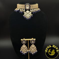 Beautiful silver foil kundan Choker with carved stones. Elevate your style with the exquisite Diva necklace and earring set, exclusively available at our luxury Indian jewelry store. Made with the finest materials, this set is a true reflection of Elegance and glamour, designed to take your look to new heights. Each piece in the set is meticulously crafted to ensure superior quality and attention to detail. The necklace and earring set is the perfect addition to your collection offering versatil Elegant Blue Kundan Necklace With Intricate Design, Luxury Festive Silver Jewelry Sets, Luxury Silver Kundan Necklace With Elegant Design, Elegant Blue Kundan Bridal Necklace, Blue Formal Jewelry With Stone Work, Formal Blue Jewelry With Stone Work, Blue Kundan Necklace With Intricate Design For Festive Occasions, Festive Blue Kundan Necklace With Intricate Design, Luxury Silver Kundan Necklace For Festive Season