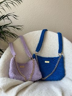 What's your choice, lilac or blue? This crochet bag is so comfy that you will wear it every day. The crochet strap makes it an easy crossbody bag to wear all day long. You also have a little curb chain, so you can remove the big strap if the night arrives and you prefer a more chic and compact shoulder bag. If you would love to have this bag model in other colors, write us: contact@jeleja.com   Handmade bag: crochet technique on the bag and on the strap; recycled cotton (lilac or blue); curb cha Handmade Trendy Purple Bag, Trendy Handmade Purple Bag, Trendy Handmade Blue Bags, Trendy Blue Crochet Bags, Daily Use Purple Crochet Bag, Lavender Crossbody Shoulder Bag For Everyday, Lavender Shoulder Bag For Everyday Use, Everyday Purple Mobile Phone Bag, Purple Crochet Tote Shoulder Bag