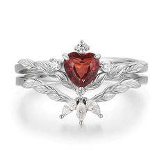 Radiating warmth and love is our Flaming Heart Red Garnet Ring Set© that unveils a heart-shaped red garnet gem at the center of a silver leaf patterned band with a matching topaz stacking ring to add a perfect splendor. A glimmering set that serves as a beautiful reminder to know your worth, spread love, and make a difference. It is also a perfect and timeless symbol of love with a promise to stay forever. ✦ Available in both 14K white gold vermeil (14K white gold plated over a sterling silver b Red Garnet Stackable Anniversary Rings, Red Garnet Stackable Rings For Anniversary, Red Garnet Stackable Rings, Heart Shaped Ruby Ring In White Gold For Wedding, White Gold Heart-shaped Ruby Wedding Ring, Heart-shaped Red Ruby Ring In Sterling Silver, Red Heart-shaped Birthstone Ring, Red Sterling Silver Stackable Wedding Rings, Red Sterling Silver Stackable Rings For Wedding