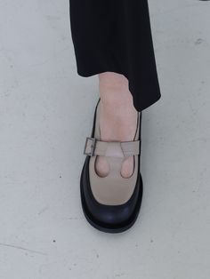 Editor's NoteMOL:pin presents sophisticated footwear that gives off a stylish mood.- Round shaped toe loafer- Unique T-strap on the instep- Soft and durable cow leather used- Color block design point- Comfortable to wearMeasurements(in.)- Size: KR 225MM (US 5.5) ~ KR 255MM (US 8.5)- Heel Height: 0.31 in. Composition & Care- Upper: Cow Leather / Lining: Pigskin- Natural leather may have fine scratches and wrinkles- Bright leather can get stained by denim or dark outfits- Pen and bon Pointed Toe Calf Leather Monk Strap Shoes For Work, Formal Slip-on Mary Janes With Rubber Sole, Closed Toe Court Shoes With Buckle For Work, Round Toe Court Shoes With Buckle Closure For Work, Mary Jane Slip-on Work Heels, Mary Jane Slip-on Heels For Work, Office Wear Almond Toe Mary Janes With Buckle, Formal Slip-on Mary Janes For Fall, Formal Fall Slip-on Mary Janes