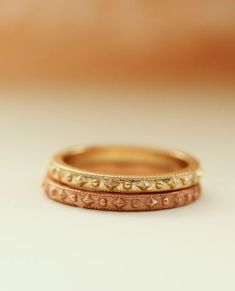 Cherished Gold Ring
With a delicate confetti beaded pattern surrounding the entire band, she's a reminder you're cherished. You cherish those you love most.  Beautiful crafted stacking ring perfectly pairs with other Erin Pelicano rings, or as a band worn in her own beauty. Stack one for each child, stack one for each of your favorite people, collect one for each milestone, or wear as your wedding band.

Designed and crafted in solid 14k gold, choose from white, yellow, or rose gold.

 	14k Adjustable Stackable Bands For Promise, Heirloom Style Stackable Diamond Cut Rings For Promise, Heirloom Stackable Eternity Band As Gift, Fine Jewelry Stackable Promise Rings With Decorative Band, Fine Jewelry Stackable Decorative Band Rings For Promise, Heirloom Style Promise Stackable Rings, Stackable Promise Ring Band, Heirloom Style Stackable Midi Rings For Wedding, Heirloom Stackable Midi Rings For Wedding