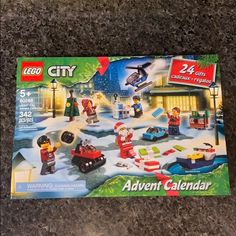 a lego city christmas calendar is shown on the floor