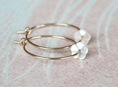 "Gold Filled Hoop Earrings, Tiny White Mother of Pearl Flower Hoop Earrings, Gold Hoop Earrings, Gold Earrings, Flower Hoops, Bridal Earrings, Gift for Her, Romantic Earrings, Feminine Earrings, Small Hoops, Dainty Earrings, MOP Earrings Adorable, feminine and lightweight 14k gold filled hoop earrings with the sweetest and tiniest carved white mother of pearl flowers. D E T A I L S: => Metal Type - 14k Gold Filled => Hoop size - Approx. 2 cm in diameter => Length - Approx 2 cm / 0.78\" Flower Hoop Earrings, Letter Charm Necklace, Feminine Earrings, Pearl Flowers, Romantic Earrings, Earrings Gold Hoop, Rose Gold Flower, Sakura Flower, Hoops Gold