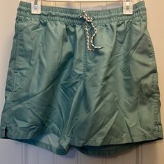 Goodfellow & Co Teal Swim Shorts. Size Medium. The Inside Netting Has Been Removed But The Pocket Netting Remains. Otherwise I’m Good Condition. No Discoloration And Never Worn In The Water. Green Swim Trunks With Pockets Relaxed Fit, Green Swim Trunks With Pockets And Relaxed Fit, Green Relaxed Fit Swim Trunks With Pockets, Green Drawstring Short Swim Trunks, Green Drawstring Swim Trunks Short Length, Green Drawstring Swim Trunks, Spring Beachwear Swim Trunks With Pockets, Beachwear Swim Trunks With Pockets For Spring, Green Vacation Bottoms With Drawstring