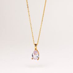 This timeless necklace features a stunning teardrop-shaped diamond pendant with dainty gold chain necklace. A delicate piece that is sure to catch eyes. Wear it on its own or layer with your other favorite necklaces and pendants. ∙DETAILS Diamond: 11mm x 8mm CZ Diamond Chain: 16'' + 2'' Made of 925 Sterling Silver Plated with 18K Gold Waterproof & hypoallergenic ∙ Free Diamond Eternity Ring will be automatically packed to eligible orders until 22nd of May. You don't have to add Eternity Ring to Gold Solitaire Teardrop Pendant Necklace For Formal Occasions, Gold Teardrop Pendant Solitaire Necklace For Formal Occasions, Gold Solitaire Necklace With Teardrop Pendant For Formal Occasions, Elegant Gold Solitaire Teardrop Necklace, Elegant Teardrop Solitaire Necklace With Delicate Chain, Solitaire Teardrop Pendant Necklace, Classic Drop Necklace With Delicate Teardrop Pendant, Dainty Solitaire Necklace With Teardrop Pendant For Formal Occasions, Delicate Teardrop Pendant Drop Necklace For Anniversary