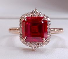 17 Carats Big Asscher Shaped Red Ruby And Round Diamond Engagement Ring Gold 14K Red Diamond Ring, Round Diamond Wedding Rings, Minimalist Diamond Rings, Blue Diamond Engagement Ring, Gold Diamond Wedding Rings, Ruby Diamond Ring, Ruby Rings, Ruby Diamond Rings, Topaz Engagement Ring