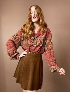 "90s Flowy Button Up Classic bohemian paisley print in red, gold and dark navy blue. Navy buttons down the front. Features a loose fitting collar as well as subtle balloon sleeves. Very lightweight and flowy material. Measurements Shoulders 18\" Bust 48\" Length 26\" Measurements taken with garment laid flat." Vintage Long Sleeve Tops With Boho Print, Vintage Long Sleeve Paisley Print Blouse, Vintage Long Sleeve Blouse With Paisley Print, Vintage Boho Print Blouse For Fall, Fall Button-up Blouse With Vintage Print, Bohemian Red Button-up Top, Bohemian Red Tops With Buttons, Bohemian Blouse With Vintage Print For Fall, Vintage Paisley Print Button-up Top