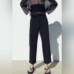 High-Waisted Trousers With Straight Legs. Front Pockets, Patch Pockets With Flap On The Sides At The Back. Zip And Button Closure. Zara Cotton Bottoms For Workwear, High Waist Wide Leg Cargo Pants For Work, Utility High Waist Wide Leg Work Pants, Chic High-waisted Parachute Pants With Cargo Pockets, Zara High-waisted Bottoms With Pockets, Black Cargo Pants For Summer, Black Cargo Pants With Belt Loops For Work, Black Summer Cargo Pants, Zara Straight Leg Cargo Pants For Work