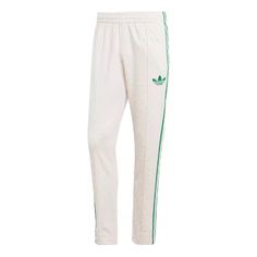 adidas originals Adicolor 70s Monogram Track Pants 'Wonder White Green' IP6984 Adidas Relaxed Fit Sweatpants With Three Stripes, Adidas Sportswear Pants For Spring, Adidas Sporty Sweatpants For Spring, Casual Adidas Cotton Bottoms With Logo, Sporty Adidas Joggers For Spring, Casual Adidas Cotton Bottoms, Casual Cotton Bottoms With Adidas Logo, Cotton Relaxed Fit Pants With Adidas Logo, Three Stripes Relaxed Fit Sportswear Pants