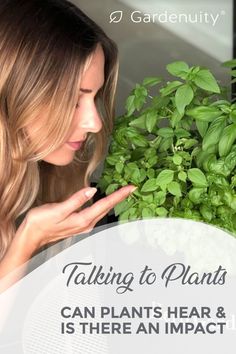 a woman looking at plants with the words talking to plants can plant hear and is there an impact?