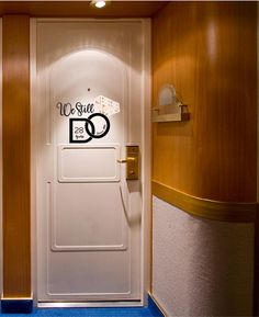 an open door leading to the bathroom on a cruise ship