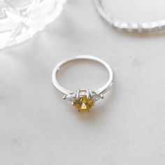 Beautiful dainty Canary Diamond ring. Symbolic of wisdom, long-lasting happiness and love, this ring would be perfect as a promise, engagement, or wedding ring! Made of 925 Sterling Silver THICK plating of 14k Gold or Rhodium Available in Sizes 4-10 Canary diamond size: 6mm Made of highest quality cubic zirconia VERY HIGH QUALITY Nickel-free & Hypoallergenic - will NOT turn fingers green! Ring Sizer White Gold Open Ring Diamond Ring With Birthstone, Sterling Silver Wedding Ring With Center Stone For Proposal, Fine Jewelry Open Band Birthstone Promise Ring, Fine Jewelry Birthstone Promise Ring With Open Band, Dainty Cubic Zirconia Crystal Ring For Proposal, Yellow Sterling Silver Crystal Promise Ring, Yellow Sterling Silver Promise Ring, Classic Promise Crystal Ring With Gemstone, Crystal Open Ring With Prong Setting For Promise