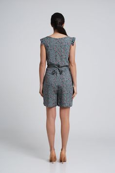 "A lightweight short summer romper feturing v-neckline, short ruffled sleeves and a shift silhouette. - V neck - short ruffled sleeves - shift silhouette - front button closure - two pockets in side seams - fabric belt - mini length (above the knee) - flower print Fiber: 100 % viscose Color: dark green For Size S (06 US): length - 34\" (87 cm) You may feel free choosing the size. Just send us your measurements (bust, waist, hips, height)." Summer Jumpsuits And Rompers With Tie Waist And V-neck, Green V-neck Jumpsuits And Rompers For Summer, Green V-neck Jumpsuit For Summer, Summer Printed V-neck Jumpsuits And Rompers, Summer Jumpsuits And Rompers With Tie Waist, Summer V-neck Jumpsuits And Rompers With Floral Print, Summer Floral Print V-neck Jumpsuits And Rompers, Casual Summer Jumpsuits And Rompers With Ruffles, Summer Jumpsuit With Floral Print And V-neck