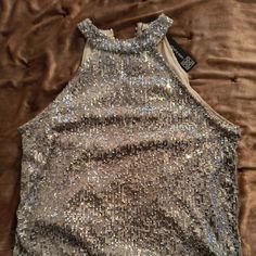 Cable And Gauge Sequined, Sleeveless Top, Lined. Sz Lg. Glamorous Sleeveless Camisole For Party Season, Party Sleeveless Camisole, Stretch Sleeveless Tank Top For Party, Sequined Sleeveless Camisole For Parties, Sleeveless Sequined Camisole For Party, Chic Racerback Party Tops, Sleeveless Camisole For Evening Parties, Glamorous Sleeveless Camisole, Party Sequin Sleeveless Camisole