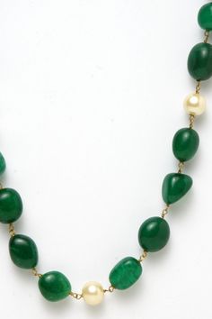 Hancrafted Looped semi pecious Emerald and Pearls to style you fo everyday look it is easy and lightweight to carry your everdday grace and eleganceAnd It Contains 1 Necklace. Product Features :   Color: Green Material: Silver Dimensions: 81 cm Length x 0.5 cm width Product Weight: 145 Grams Disclaimer: Color and Texture may have slight variation due to photography Elegant Emerald Necklace With Beaded Chain, Elegant Green Oval Bead Necklaces, Elegant Green Necklaces With Oval Beads, Elegant Green Oval Beaded Necklaces, Elegant Green Single Strand Necklace, Elegant Green Oval Beads Jewelry, Elegant Emerald Necklace With Beaded Chain For Gifts, Elegant Emerald Necklace With Polished Beads, Elegant Single Strand Necklace With Oval Beads