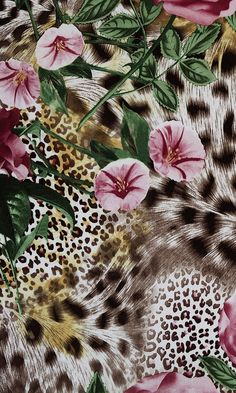 an animal print fabric with pink flowers and leopard spots on the side, as well as cheetah