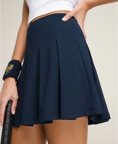 Classic Pleated Skirt | Wilson Sporting Goods Casual Spring Sports Pleated Skirt, Casual Pleated Tennis Skirt With Lining, Casual Fitted Tennis Skort, Classic Summer Skort, Casual Tennis Skort With Lined Skirt, Casual Fitted Navy Tennis Skirt, Navy Casual Fitted Tennis Skirt, Navy Casual Tennis Skirt, Casual Fitted Tennis Skirt