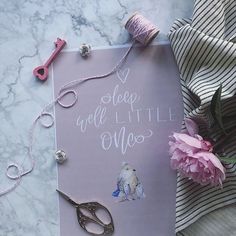 a card with scissors, thread and flowers on it that says sleep well little moo