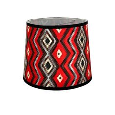 a red and black lamp shade on a white background