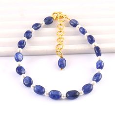 Natural Blue Sapphire Fresh Water Pearl Beads Sapphire Gemstone Beads Blue Sapphire Beads 7 Inch Bracelet Product -; Blue Sapphire Grade-: AAA High Quality Stone shape-: Faceted Beads Shape Color= blue Length-: 7 Inch Quantity -: 1 Strand Size-: 5/7 MM Genuine Measurements and weight are close to approximations We accept bulk or wholesale orders for any gemstone which you'll get best wholesale prices! Hence you can contact me with your requirement of bulk or wholesale order. I'll be happy to ful Blue Hand-strung Pearl Bracelet With Round Beads, Blue Pearl Bracelet With Natural Round Beads, Blue Pearl Bracelet With Natural Stones, Blue Beaded Bracelets With Faceted Oval Beads, Blue Oval Beaded Bracelets With Faceted Beads, Adjustable Blue Pearl Bracelet With Natural Stones, Bohemian Blue Pearl Bracelet With Round Beads, Blue Beaded Pearl Bracelet With Round Beads, Blue Pearl Bracelet With Gemstone Beads For Gift