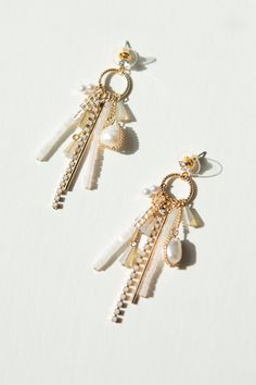 Upgrade your jewelry game with our brand new Charm Drop Earrings! These stud earrings feature a unique combination of bead, pearl, and jewel charms attached to a circular drop. The 14K gold plating adds a touch of elegance while the nickel-free materials ensure comfort for sensitive ears. Make a statement with these playful and stylish earrings! Elegant Pearl Charm Drop Earrings, Refined Pearl Charm Earrings For Formal Occasions, Glamorous Pearl Drop Earrings With Pearl Charm, Glamorous Pearl Charm Drop Earrings, Elegant Pearl Charm Chandelier Earrings, Stylish Earrings, Stylish Earring, Shoe Gifts, Bridesmaids And Groomsmen