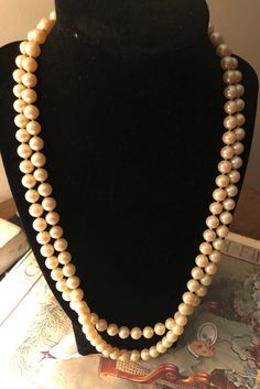 I am offering a double strand glass pearl necklace. This 1950s necklace has a nice weight. The closure is an oval set with mother of pearl. Vintage Double Strand Pearl Necklace, Vintage Multi-strand Pearl Necklace For Formal Occasions, 1950s Necklace, Applique Pillows, Stick Pins, Seed Pearl, Vintage Turquoise, Box Chain, Pink Cotton