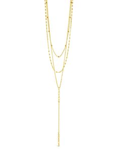 Bring out your layered look with this Natalia layered necklace! With its delicate chain drop, it'll be sure to check all the “cute” boxes and add the perfect touch of chicness to any ensemble. Dazzle your friends with your dainty, yet bold style! Materials: 14K gold plated brass Features: Measures 14-20" with 2" extender, 3.75" drop, 1-2mm chains, Lead & Nickel free, lobster clasp Elegant Adjustable Layered Chain Necklace, Gold Dangle Chain Necklace For Layering, Gold Multi-strand Lariat Necklace For Layering, Double Strand Lariat Necklace With Clavicle Chain For Layering, Elegant Satellite Chain Layered Choker Necklace, Double Chain Lariat Necklace For Layering, Dainty Double Chain Lariat Necklace For Layering, Double Strand Lariat Necklace With Adjustable Chain For Layering, Gold Drop Necklace With Adjustable Chain For Layering