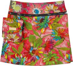 A trendy snap buttoned short wrap skirt with multicolored flowers in a dominating pink background, that reverses into a grey short skirt with complimentary flower print. A great bohemian style - this mini skirt for the modern fashion lovers has a really cool pocket pack snapped that can be snapped in and out when the skirt is worn reversed. #tlb #WrapAroundSkirt #JuniorPetite #Pocket #vacationclothing #beachwrap #Floral #Printed #bohemianfashion #waistpocketskirt #miniskirt #snapbuttonedskirt Hippie Cotton Mini Skirt For Spring, Casual Multicolor Floral Print Skort, Multicolor Cotton Mini Skirt With Floral Print, Multicolor Floral Print Cotton Mini Skirt, Multicolor Floral Print Mini Skort, Summer Multicolor Floral Print Skort, Pink Mini Skirt For Spring Festival, Trendy Multicolor Lined Skort, Spring Multicolor Skort