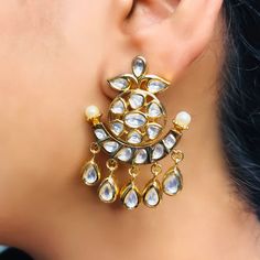 These are a beautiful pair of Earrings, made with beautifully Kundan beaded. These earrings work well with all types of clothing, whether it be formal attire or a casual party. Option 1 : Red Color (E718) Option 2 : White Color (E719) Eye-catching and unique jewellery that will set you apart. Gift this piece to a loved one, and see their face light up with joy. Best for gifting or for personal use, wear it to any occasion and be in the spotlight. Elegant Dangling Beads Earrings For Festivals, Elegant Dangling Beaded Earrings For Festivals, Elegant Beaded Earrings With Dangling Beads For Festivals, Elegant Chandbali Earrings With Dangling Beads, Elegant Chandbali Beaded Earrings With Dangling Beads, Elegant Beaded Danglers For Party, Festive Elegant Earrings With Dangling Beads, Festive Elegant Dangling Bead Earrings, Elegant Festive Beaded Chandelier Earrings