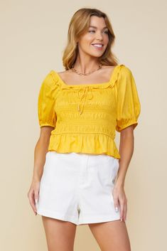 Here comes the sun. Done in a golden yellow shade, this lightweight jacquard top features a smocked bodice, short sleeves, and a ruffle-trimmed square neckline with metal-tipped tie detailing. •Square neckline  •Ruffle trim  •Metal-tipped tie detail  •Short sleeves  •Smocked bodice  Item Number: 44681 Vacation Dresses Casual, Wedding Guest Dress Trends, Skirt And Top Dress, Character Fashion, Mango Sorbet, Jacquard Top, Aesthetic Moodboard, Here Comes The Sun, Casual Wedding Dress