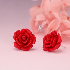 These elegant resin rose flower stud earrings feature a beautiful rose design in white or red color, complete with a sterling silver needle and back. Perfect for weddings and as a luxurious gift, these earrings can also elevate any outfit for daily wear. Enhance any outfit and feel truly elegant with these stunning resin rose flower stud earrings! Available in both white and red, their captivating rose design and high-quality sterling silver needle and back make them a luxurious addition to your daily wardrobe. Perfect for weddings or as a thoughtful gift, these earrings will surely make a statement and leave a lasting impression. Add a touch of beauty and sophistication to your style with these exquisite studs. Materials: 925 sterling silver, resinDiameter: 0.79 in Jewelry Care: See more Formal Rose Earrings With Rose Design, Formal Rose-design Rose Earrings, Rose Design Flower Earrings For Formal Occasions, Rose Design Flower Earrings For Anniversary, Formal Rose Design Earrings, Wedding Rose Earrings, Rose Flower-shaped Earrings With Rose Design, Elegant Rose Red Flower Earrings For Pierced Ears, Red Flower Earrings For Formal Occasions