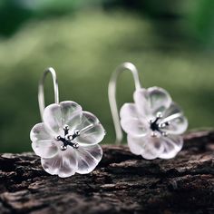 Embrace the enchanting beauty of nature's delicate blooms with our exquisite Crystal Quartz Cherry Blossom Dangle Earrings. These earrings capture the grace and elegance of cherry blossoms, meticulously crafted with crystal quartz stones and delicate metal accents, adding a touch of sophistication and ethereal allure to your every look. Shape\pattern: Cherry Blossom Flower Model Number: LFJB0066 Metals Type: Silver/18K Gold Metal Stamp: 925,Sterling Main Stone: Crystal Quartz Item Weight: about Rain Earrings, Rain Fashion, Sterling Silver Earrings Handmade, Metallic Party, No Rain No Flowers, Earrings Handmade Dangle, Sterling Silver Dangle Earrings, Stone Crystal, Crystal Flower