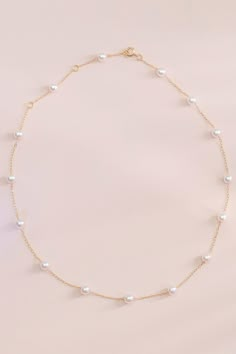 Timeless and trendy collide with our Brighton pearl necklace. It's just perfect for a Regency-inspired wedding or a cottagecore bridal shower. Wear this sweet, understated accessory with a bridesmaid's dress, a holiday sweater, or anything in between. It makes a great gift or a treat for yourself. | Jewelry | Birdy Grey Bowery Pearl Necklace Hoco Necklaces, Briolette Pearl Necklace, Hoco Jewelry, Cottagecore Necklace, Pink Pearl Necklace, Birdy Grey, Casual Necklaces, Pearl Bridal Jewelry, White Pearl Necklace