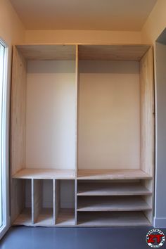 an empty room with some shelves in it