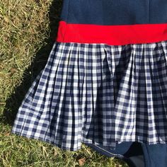 The most pretty cheerleader swimmer on the beach! The swimsuit is from the 60's or maybe 50s. Very good condition. Size: Fits today's size X Small to Small. Very tight and good stretch, makes good things to your figure. Bright colours and super cute model with the skirt on the swimsuit. Navy blue white red chevron style top + pleated skirt with squares. Halterneck style. Can't say no more, this is one of the best pieces I ever had in store. Summer School Pleated Dresses, Pleated Summer School Dress, Pleated School Dress For Summer, Preppy Fitted Tennis Dress, Summer Cheerleading Pleated Mini Skirt, Pleated Stretch Swim Skirt, Short, Cheerleading Skirt With Built-in Shorts, Cheerleading Mini Skirt Bottoms With Built-in Shorts, Vintage Cheerleader Uniform