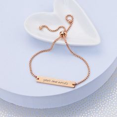 Give any woman of the wedding party this adjustable slide bracelet. We'll custom engrave it with your own words. CUSTOM ENGRAVING: ENGRAVING: [Your Own Words - 25 character max] DETAILS: MATERIAL: stainless steel FINISHES: gold, rose gold, stainless steel FIT: adjustable, one size fits most STYLE: slide, fits over hand BRACELET SIZE: up to 9 inches in diameter Slide Bracelet, Gift Inspo, Hand Bracelet, Gold Engraving, Bridesmaid Bracelet, Personalized Anniversary, Text Box, Personalized Bracelets, Engraved Jewelry