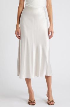 Put some slink in your step in this solid satin midi skirt fitted with a concealed-elastic waistband to help you move through your day with ease. 32" length (size Medium) Concealed-elastic waist Unlined 55% rayon, 45% viscose Dry clean Imported White Formal Midi Bottoms, Elegant Cream Skirt For Daywear, White Midi-length Bottoms For Evening, White Midi Length Bottoms For Evening, Elegant Midi Length Skirt For Daywear, Elegant Satin Bottoms For Daywear, Satin Midi-length Bottoms For Work, Satin Midi Bottoms For Workwear, Elegant Knee-length Skirt For Daywear