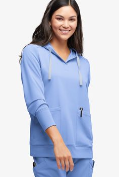 Who doesn’t love a hoodie? So comfortable – and it keeps chills off your head and neck. Here, rib-knit cuffs and bottom add extra softness. Every style in our Resurge collection is thoughtfully designed and responsibly sourced. Made of 100% recycled polyester (the most of any scrubs brand!), plus recycled trims and zippers. Even the bag it comes in is recycled. Long story short: Resurge lets you feel good and do good • Recycled fiber from approximately 21 plastic bottles • Modern fit • Hoodie st Half-zip Sports Tops With Pockets, Sports Tops With Pockets And Half-zip, Solid Athleisure Hoodie With Pockets, Solid Color Athleisure Hoodie With Pockets, Stretch Hooded Tops With Pockets, Solid Color Hoodie With Pockets For Outdoor Activities, Hoodie With Pockets For Outdoor Activities, Solid Long Sleeve Activewear With Pockets, Sporty Half-zip Hoodie With Pockets