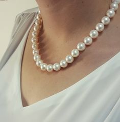 This elegant and timeless pearl necklace is a must-have in a woman's wardrobe. It goes perfectly with almost anything It's a beautiful real pearl necklace - high-quality round/semi-round in shape The pearls are white, smooth and shiny with high luster Please note, these pearls have some natural marks on them but are considered in general to be very lightly spotted in this large size I hand select each pearl strand. I travel far and invest much time effort and 30 years of pearl buying experience Pearl Necklace Classic, Double Strand Pearl Necklace, Swarovski Pearl Necklace, Classic Pearl Necklace, Genuine Pearl Necklace, Real Pearl Necklace, Beautiful Pearl Necklace, Bridal Pearl Necklace, Pearl And Diamond Necklace