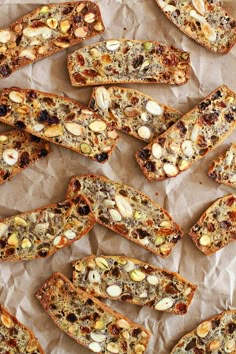 several pieces of bread with nuts and raisins on top