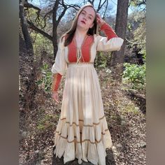 Just In Time For Fall The Most Dreamy Orange Velvet Gunne Sax Dress!! This Dress Is Literally Meant For Fall Photo Shoots With Beautiful Leaf Change Or Thanksgiving Feasts. I Have Only Seen This Dress One Other Time It Is A Very Special Dress And Hard To Find. The Velvet Is Such A Beautiful Burnt Orange Color And The Jute Natural Color Trim With The White Muslin Really Makes It Pop. The Dress Has The Classic Corset Style Bodice That Is Very Flattering. Multi Tired Skirt And Long Zipper Sleeves A Beige Fall Wedding Dress, Fall Wedding Beige Dress, Elegant Fitted Long Sleeve Peasant Dress, Elegant Fitted Boho Dress For Fall, Bohemian Fitted Medieval Dress For Summer, Spring Bohemian Fitted Medieval Dress, Fitted Bohemian Medieval Dress For Summer, Fitted Cream Maxi Dress, Spring Bohemian Medieval Dress