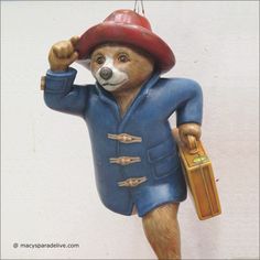 a figurine of a bear dressed in blue