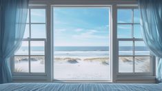 a bed sitting under a window next to a sandy beach covered in blue blankets and pillows