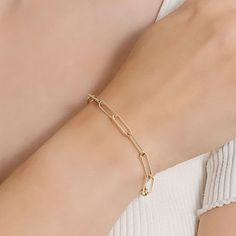 Add a trendy look to your jewelry collection by adding this Silver Reflections 14K gold over brass paperclip chain bracelet. This bracelet is crafted in 14K gold over brass, available in 7.25 inches length, has a solid paperclip chain construction and features a lobster clasp closure for a safe and comfortable wear. If you're looking for the perfect trendy chain bracelet for stacking or to wear alone, this bracelet is just what your jewelry collection needs! Wipe bracelet clean with a soft cloth Gold-tone Paperclip Bracelet With Rectangular Links, Everyday Gold-tone Paperclip Bracelet With Rectangular Links, Gold-tone Paperclip Bracelet For Everyday, Modern Gold-tone Paperclip Bracelet, Minimalist Gold-tone Paperclip Bracelet With Solid Links, Modern Gold Plated Paperclip Chain Bracelet, Modern Gold-tone Link Paperclip Bracelet, Modern Gold Chain Bracelet With Paperclip Chain, Gold Modern Paperclip Bracelet With Adjustable Chain