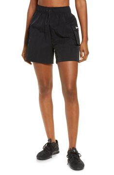 These high-waisted shorts are made from a soft, smooth woven fabric with a roomy fit, making them perfect for workouts and casual wear. Cargo pockets allow for secure storage of your small essentials. 4 1/2" inseam; 28" leg opening; 13" front rise; 17" back rise (size Medium) Drawcord-toggle waist 100% nylon Machine wash, tumble dry Imported Shorts Nordstrom, Black High Waisted Shorts, Western Clothing, Wide Leg Sweatpants, High Waist Shorts, Black Denim Shorts, Western Outfits, Nike Sportswear, High Waisted Shorts