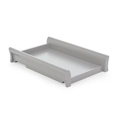 a white tray with an open drawer on it's side and the bottom section is empty