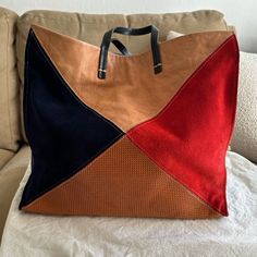 The Bag Is Made Of Very Soft, High Quality Brown And Blue Leather And Blue And Red Suede With A Blue Cotton Interior! I’m Obsessed With The Look In Theory, But Never Find Myself Reaching For It. In Excellent Condition, With Only One Very Small Flaw On The Back Blue Leather And Some Regular Tarnishing On The Inside Snap (See Photos). Can Be Used As A Handbag, Or As A Crossbody With The Detachable Shoulder Strap. Comes With Dust Bag. Comes From A Smoke Free Home. No Longer Available On The Clare V Website. Size Is 12.5" H X 14.5" W X 6.5" D. 16" H (Including Handle). Clare V., Red Suede, Blue Leather, Womens Tote Bags, Color Blocking, Red And Blue, Dust Bag, Shoulder Strap, Pouch