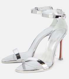 Metallic Heels With Heel Strap And Single Toe Strap, Sleek Silver Heels With Sculpted Heel, Metallic Pointed Toe Sandals With Heel Strap, Metallic Sandals With Heel Strap And Pointed Toe, Sleek Silver Sandals With Padded Heel, Modern Open Heel Sandals For Gala, Sleek Silver Heels For Gala, Metallic Sandals With Padded Heel And Pointed Toe, Modern Metallic Leather Heels